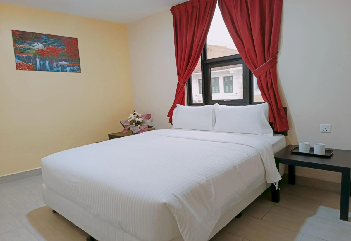 Capital O 90897 Island City Hotel