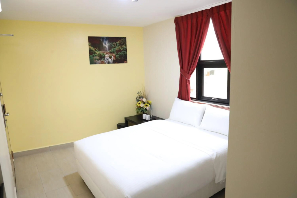 Capital O 90897 Island City Hotel