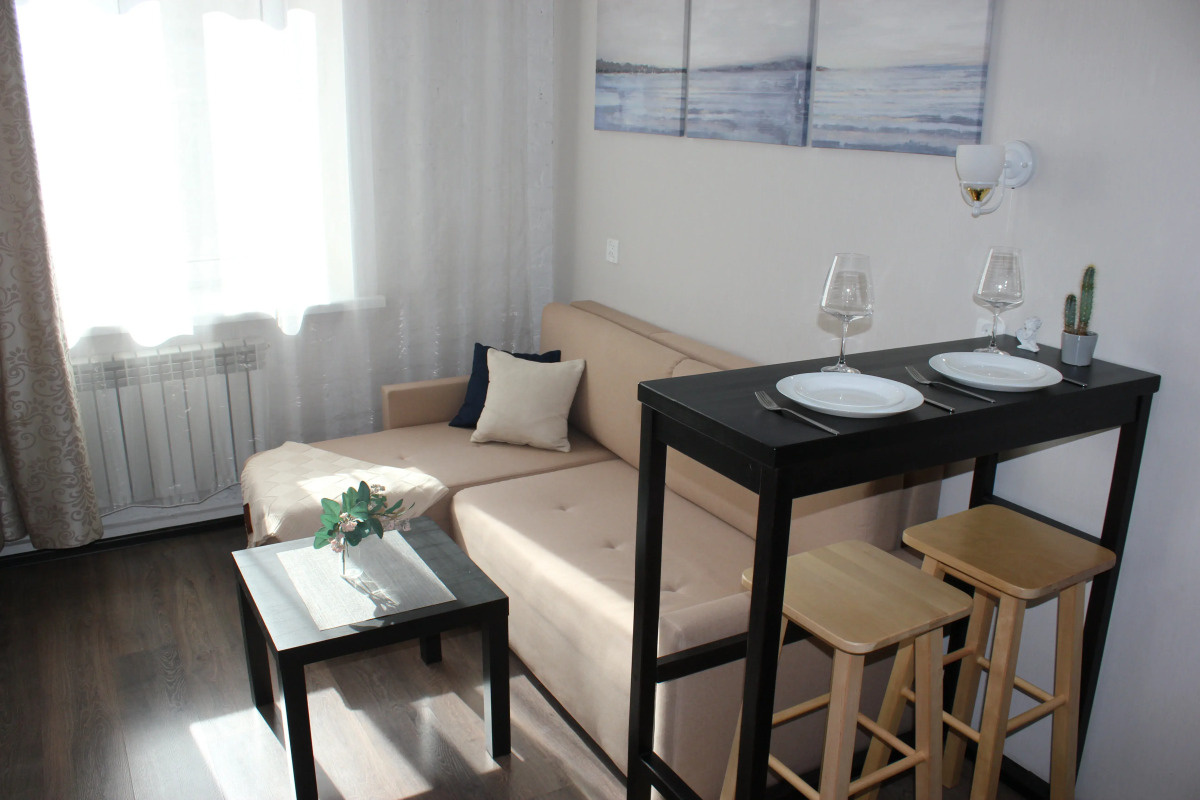 Апартаменты Уютная Двухуровневая Студия в Центре Города