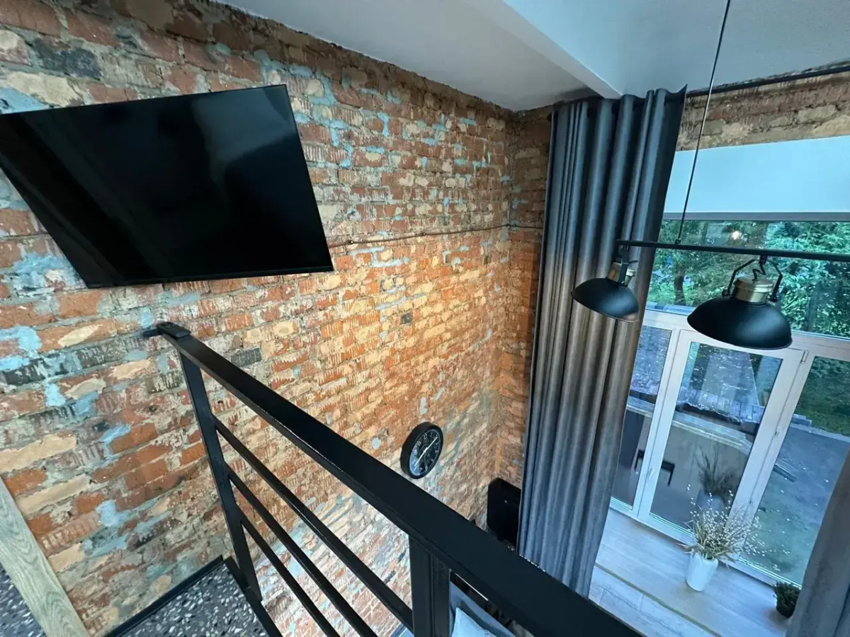 Апартаменты Двухуровневая студия с двумя санузлами в парке