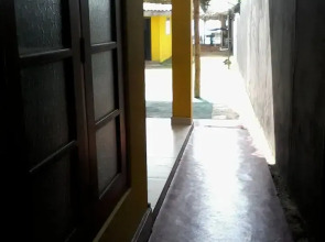 Malika's Yellow House