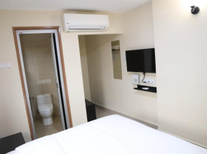 Capital O 90897 Island City Hotel