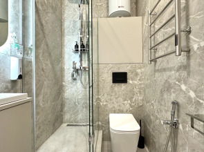 Апартаменты Уютная студия рядом с Аквапарком и Чашей