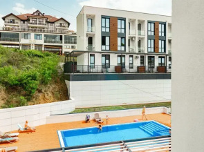 Квартира Дизайнерская студия на закрытой территории рядом с бассейном