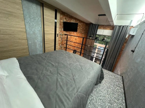 Апартаменты Двухуровневая студия с двумя санузлами в парке