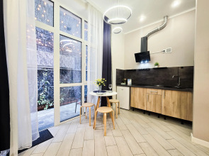 Квартира Стильная студия для 3х человек с кроватями и зоной отдыха на улице