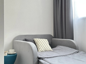 Апартаменты Уютная студия рядом с Аквапарком и Чашей