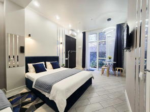 Квартира Стильная студия для 3х человек с кроватями и зоной отдыха на улице